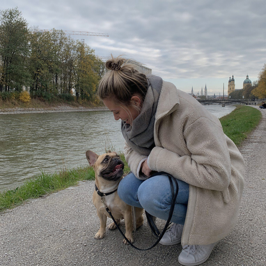 Generated example: a young woman with her French bulldog on an Isar riverbank